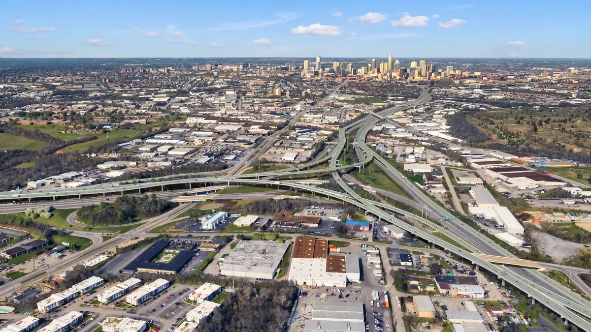 An aerial shot of a network of roads that snake over and around each other.